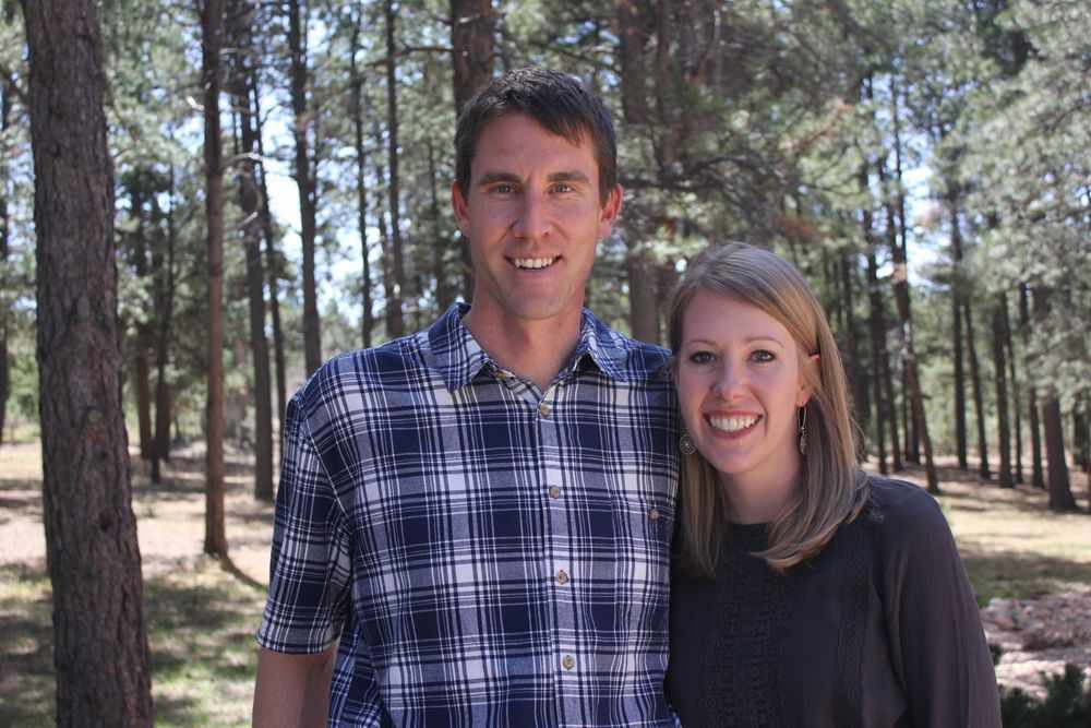 couple standing in forest