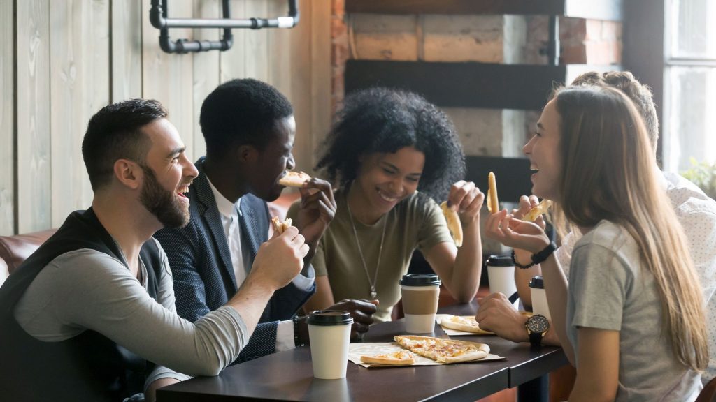 young people eating together
