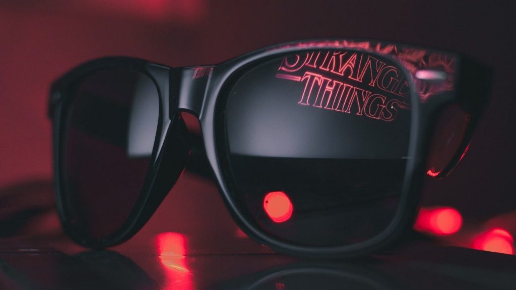 3D glasses with Stranger Things logo being reflected in them