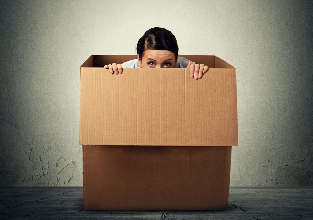 woman hiding in a box