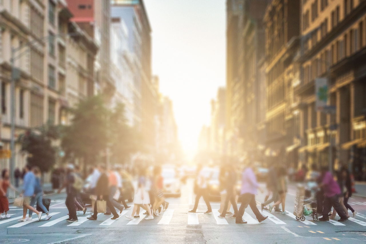 Blurred photo of people walking on main street