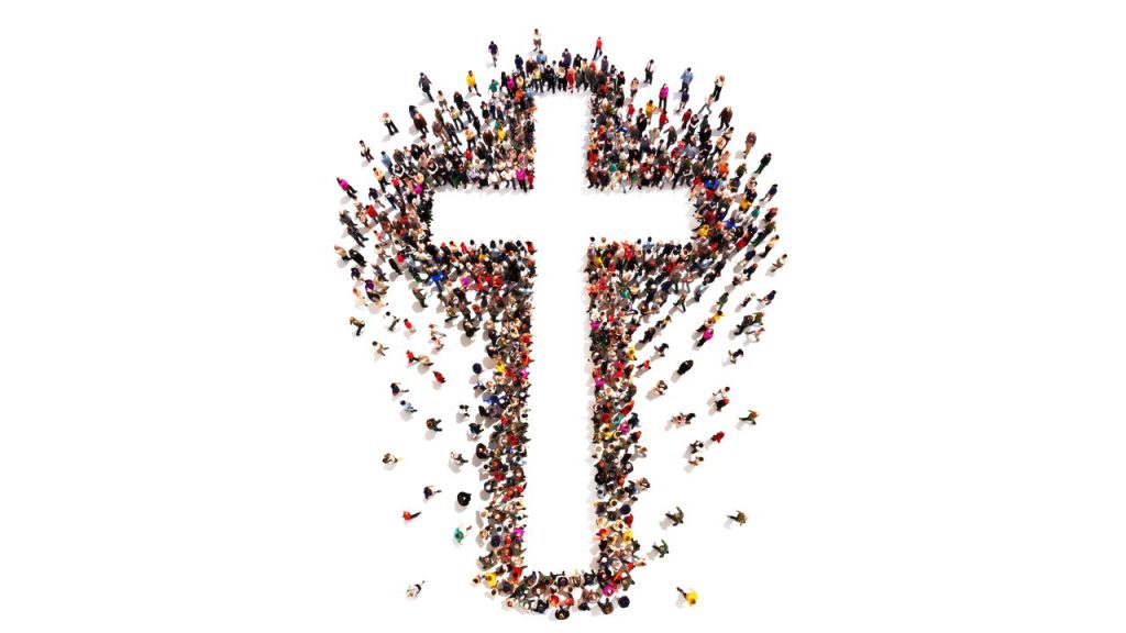 large group of people forming a cross