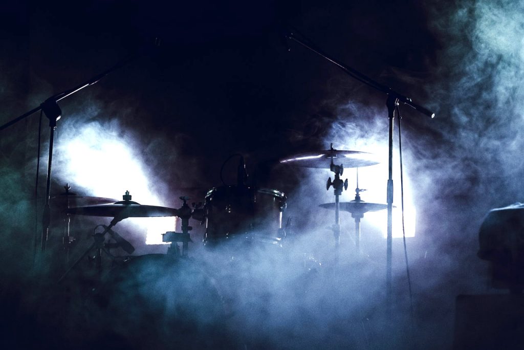 drum set surrounded by smoke, dark