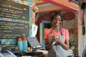 a woman working at a coffee shop, she's the only Christian at work