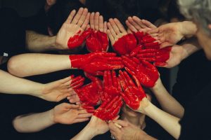 painted hands making a heart