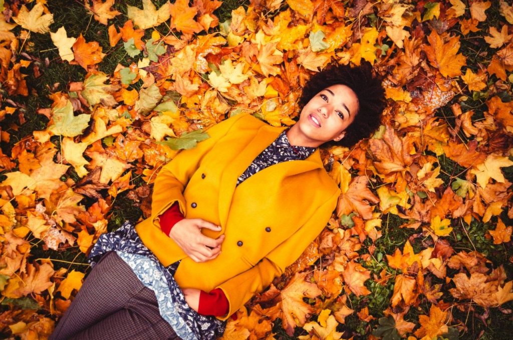 Woman laying on leaves
