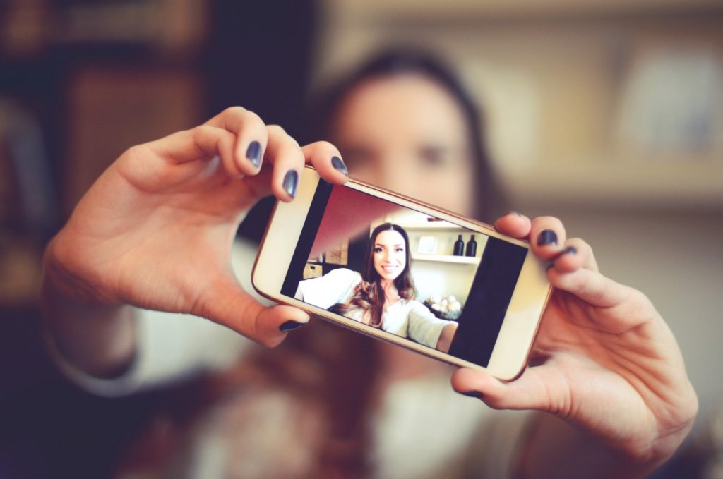 woman taking selfie