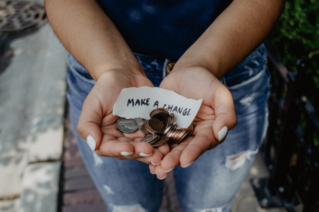 Woman holding change