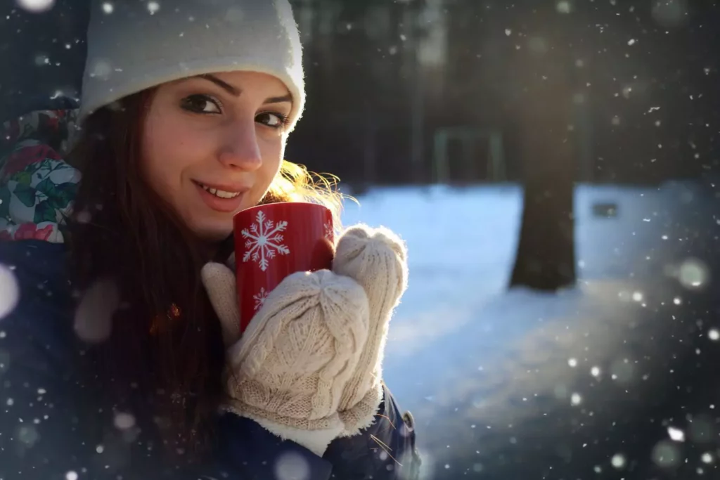 woman holding a Christmas Mug