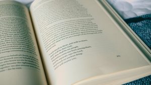 Reading Bible open on bed