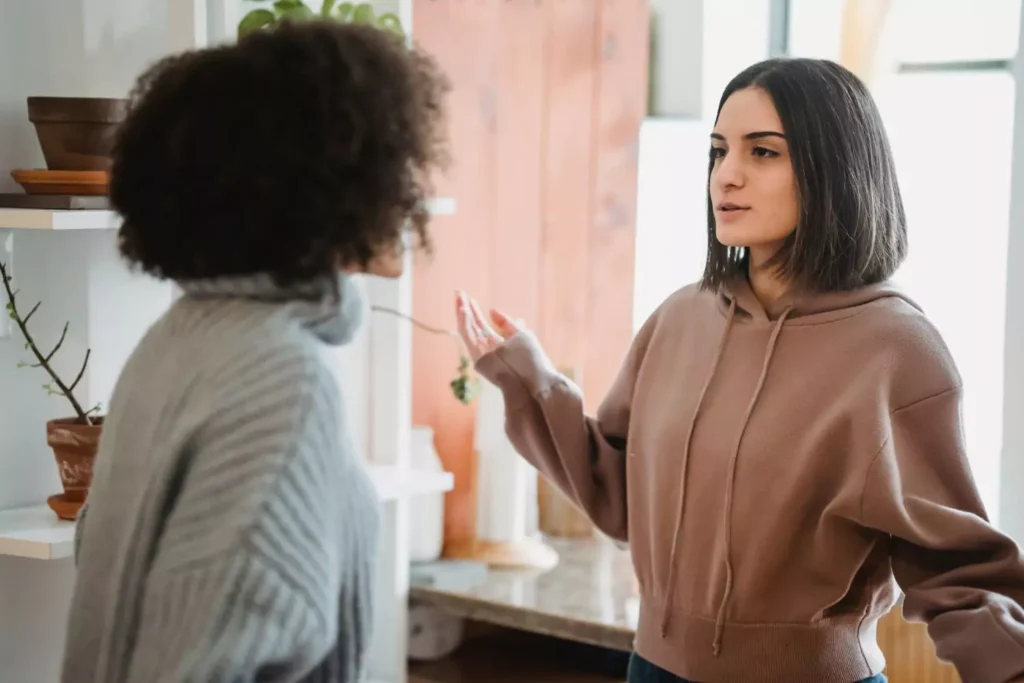 Two women having a frustrating conversation - frenemies