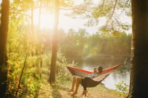 a couple on a date sitting in a hammock