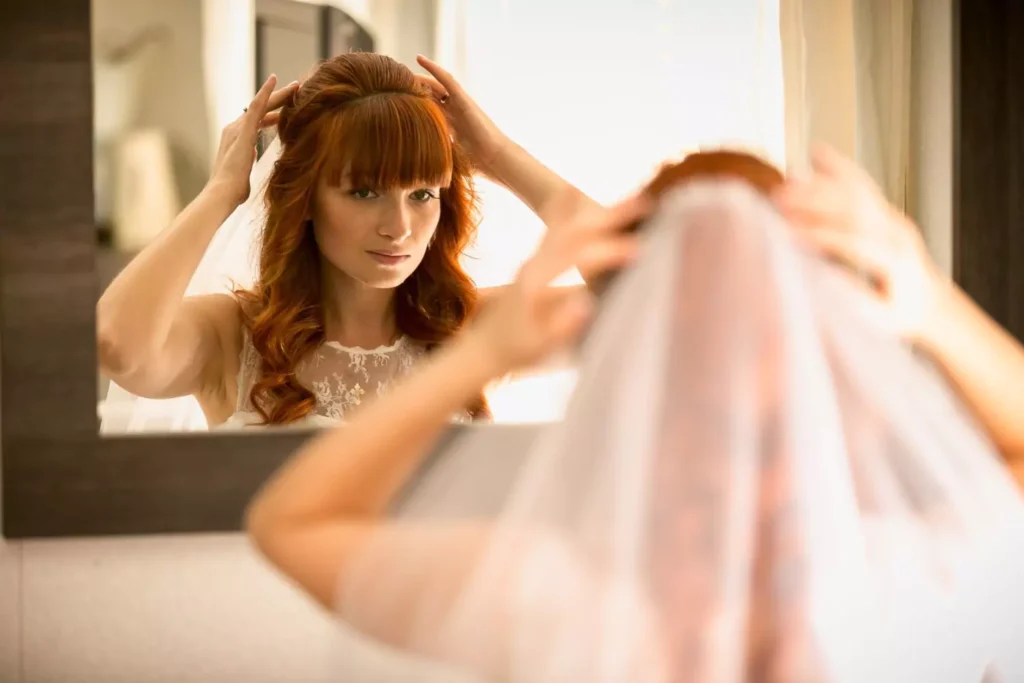 a bride looking in the mirror, has she found her potential spouse?