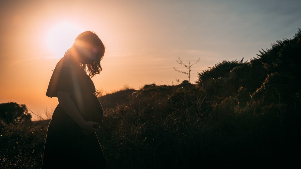 pregnant woman sunset