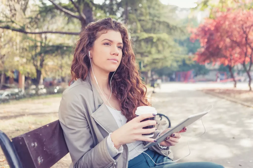 Single woman sitting on a bench on valentine's day