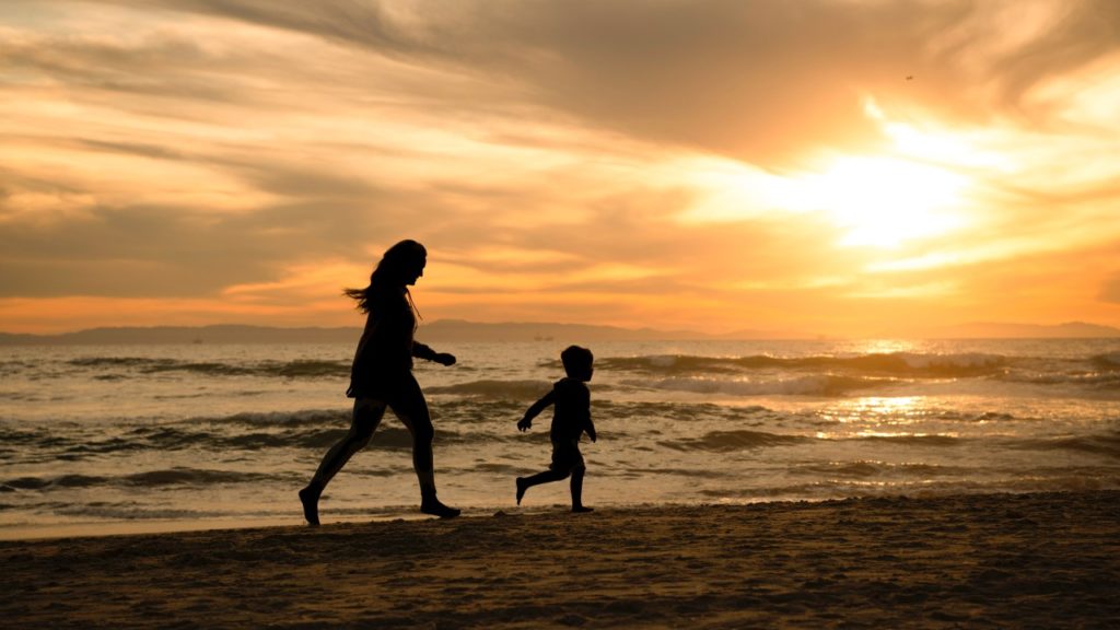 woman and child on beach