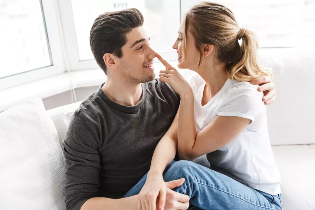 a woman poking her husband on the nose, discussing making sacrifices for one another