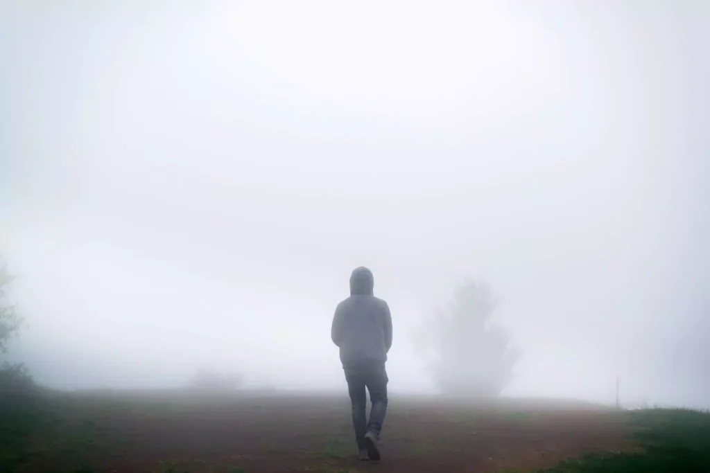 a person walking alone thinking: am i the only one with a porn problem?