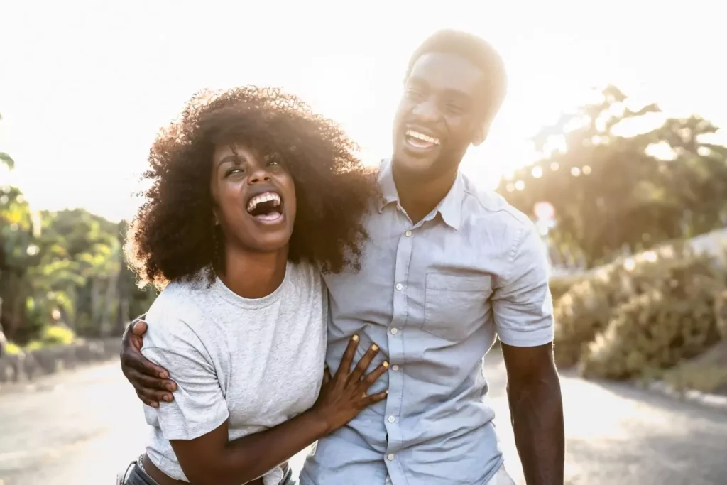 man and woman laughing