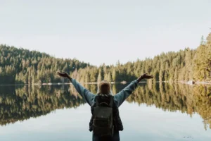 a woman feeling joy, with her hands raised