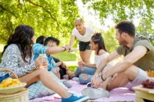 a group of friends having a picnic like a family