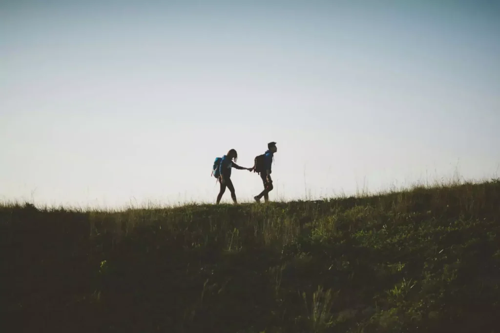 one person leading another, trusting God