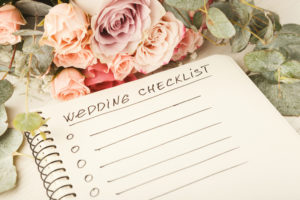 A wedding checklist is is on a table