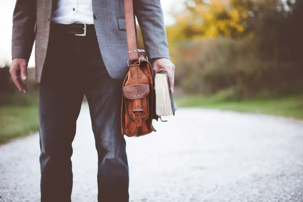 a church leader headed to church, holding a Bible