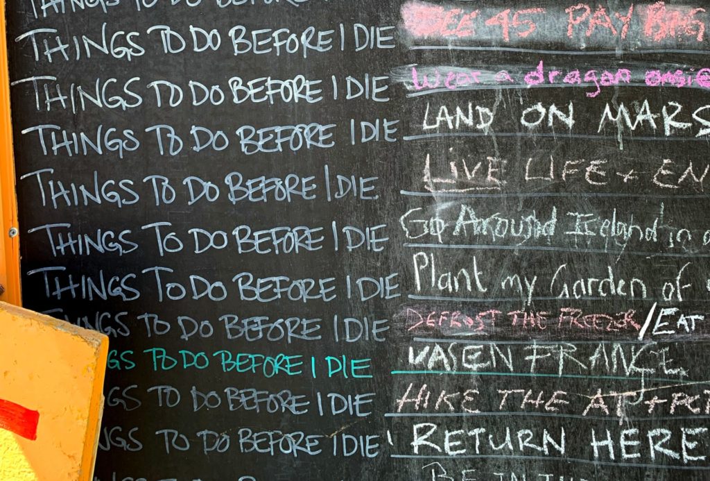 Things to do before I die written in a list on a chalkboard.