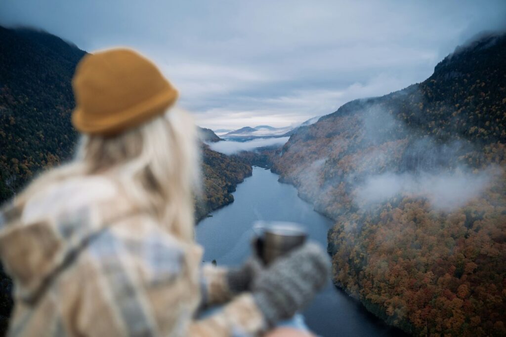 a woman feeling gratitude while overlooking a mountainscape