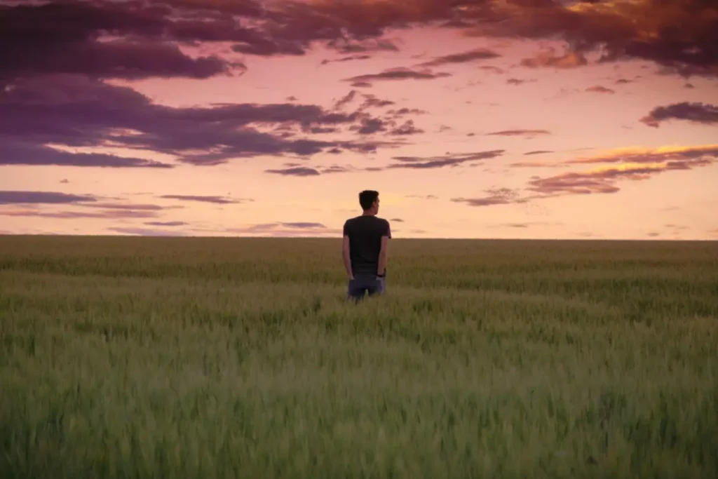 a man looking at a sunset thinking about his fear of failure