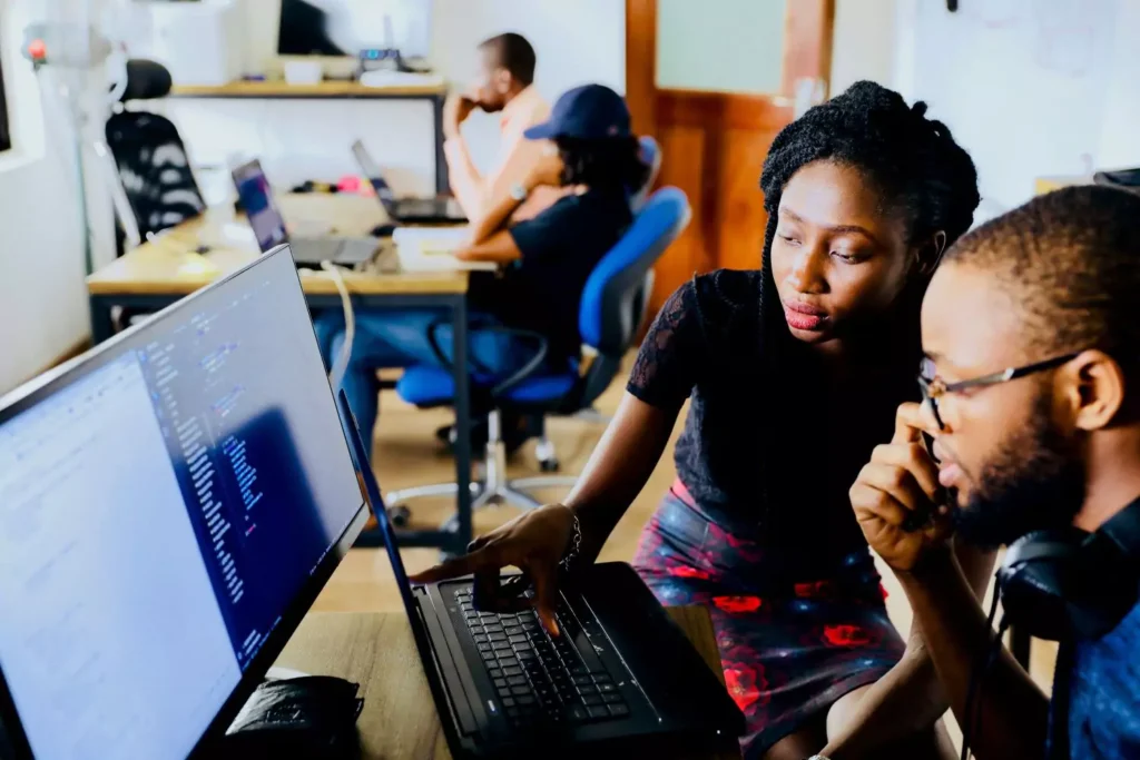two people working at a computer