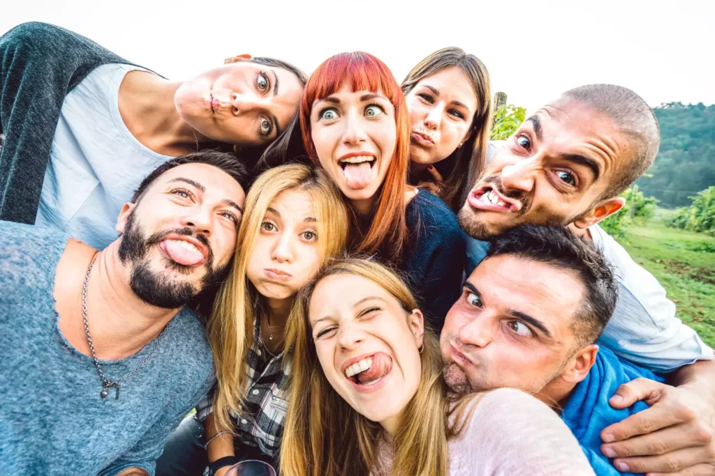 a group of friends making silly faces, facing their insecurity