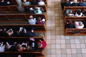 people sitting in church pews