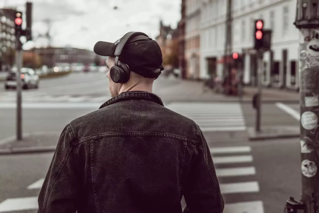 man wearing headphones, attraction