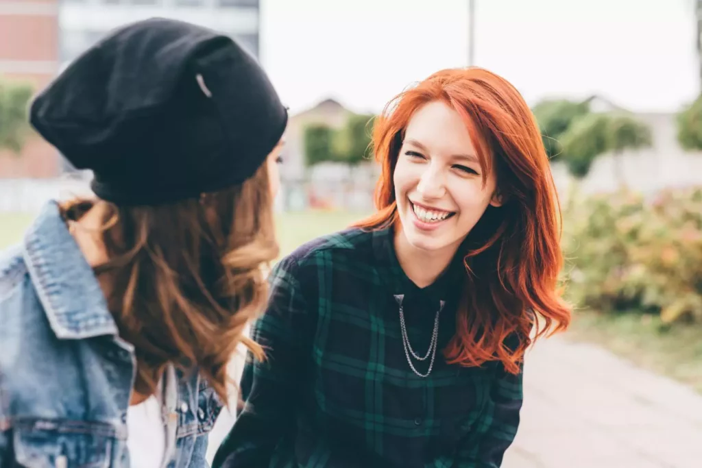 Two women talking to each other, finding something familiar.