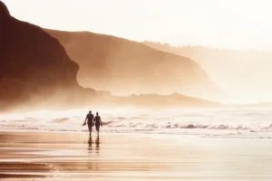 couple walking on the beach, like the golden bachelor