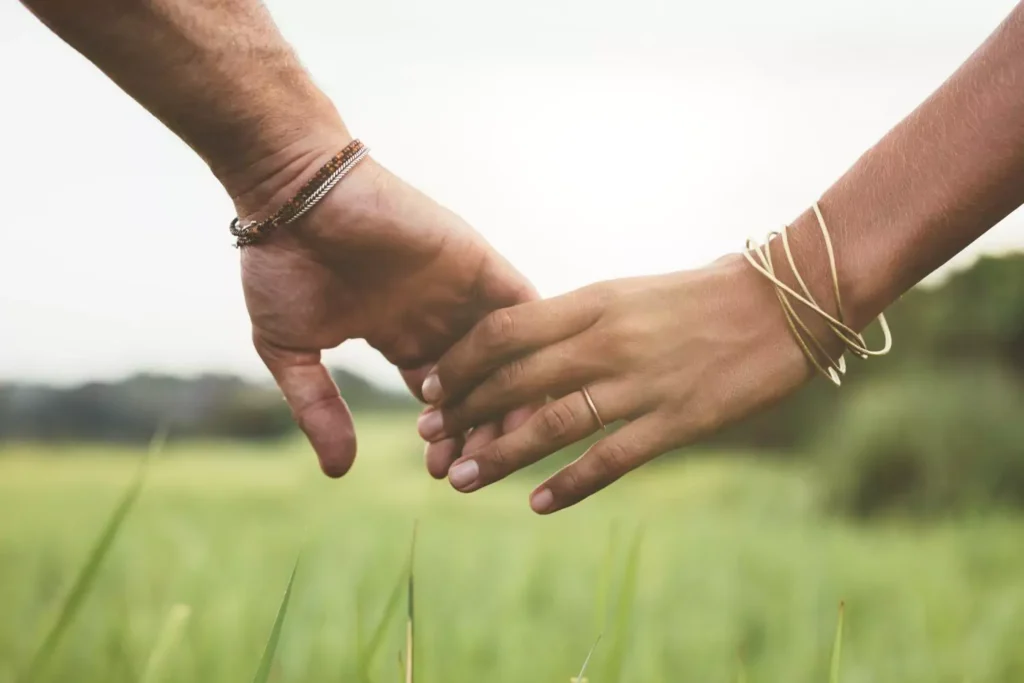 a couple holding hands - why marriage won't fix or fill you