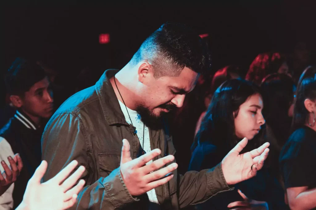 a man worshipping in his new church