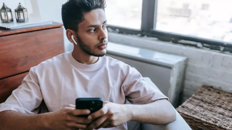 a man talking on the phone, doing a counseling consultation