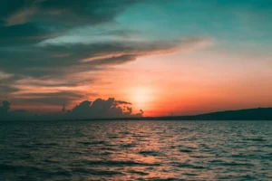 A picture of a sunset over water