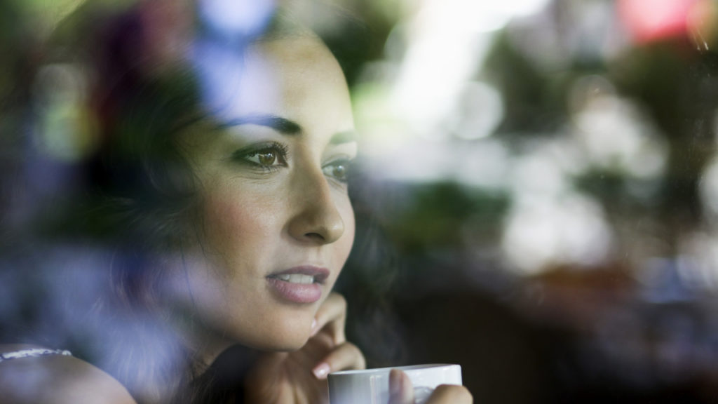 woman looking out window