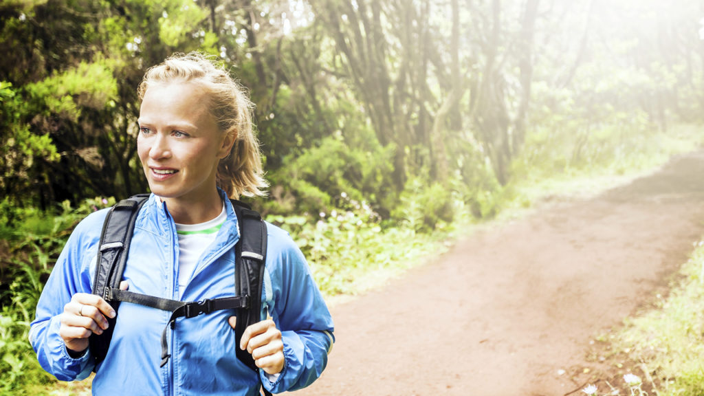 woman hiking on a path