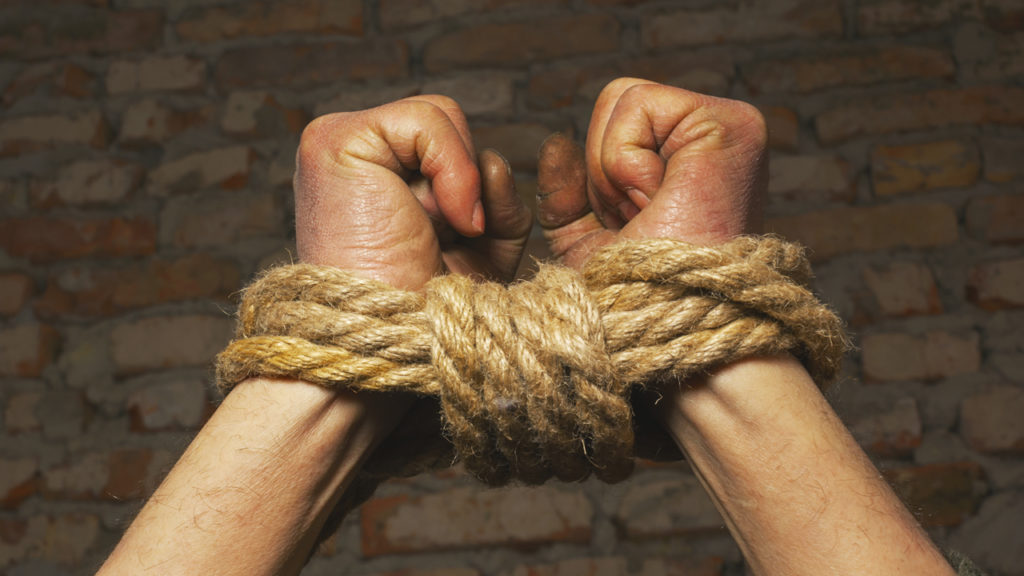 hands bound with rope