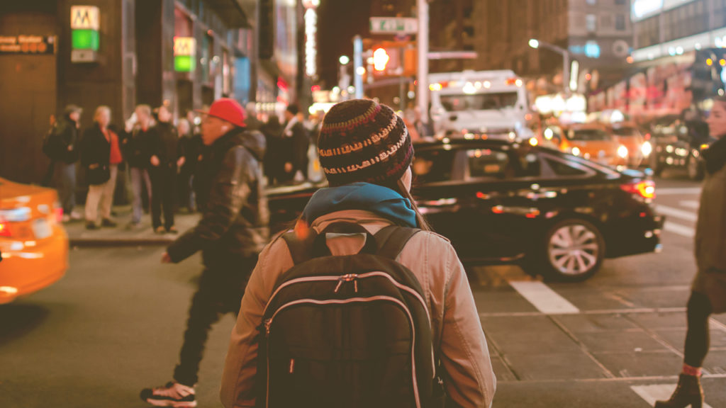 person walking in busy city