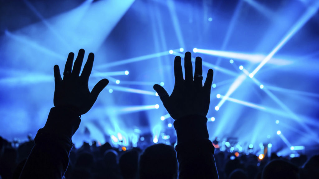 hands raised at concert