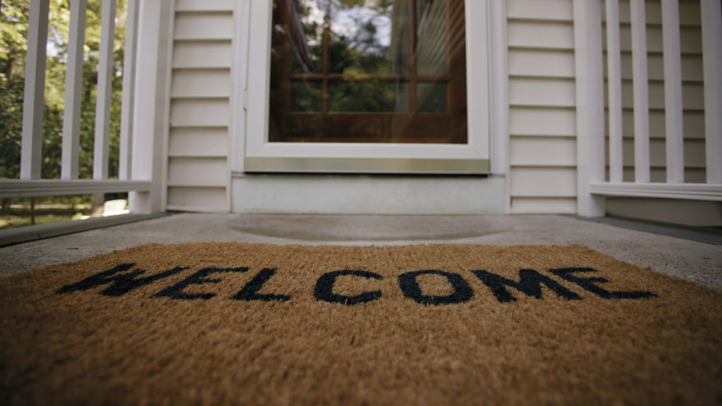 photo of 'welcome' doormat in front of door