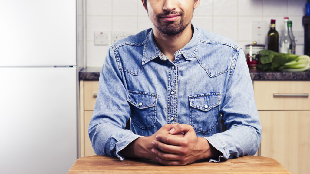 Man sitting at table waiting