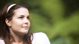 woman grinning looking into distance